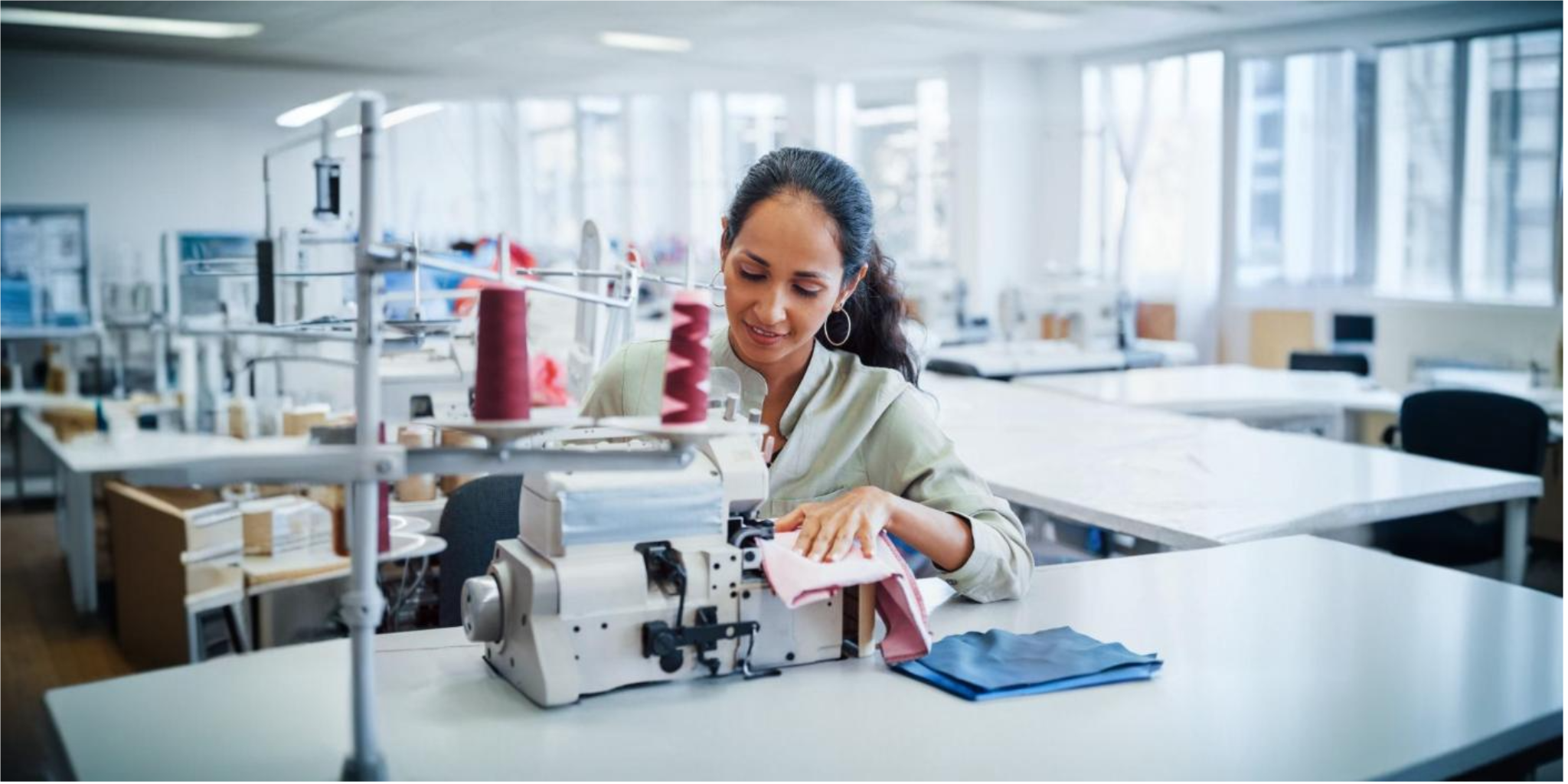 Employee working on textile machinery at Baba Spinners Limited