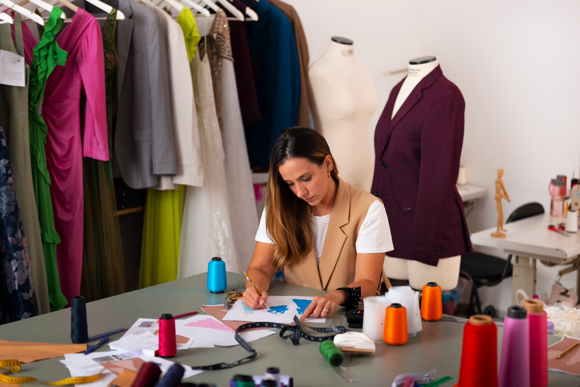 Textile professional working with colored threads